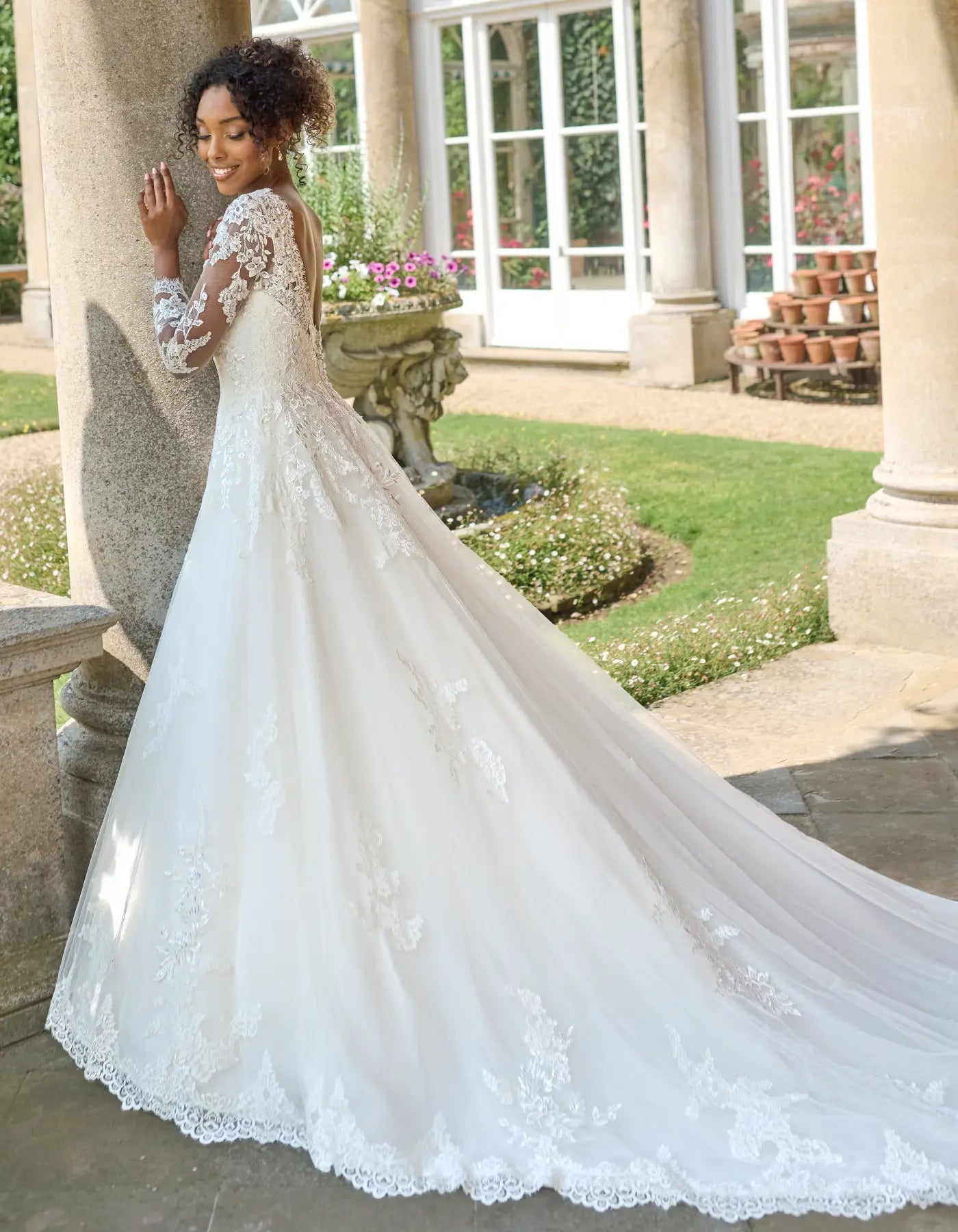 a traditional lace gown with sleeves