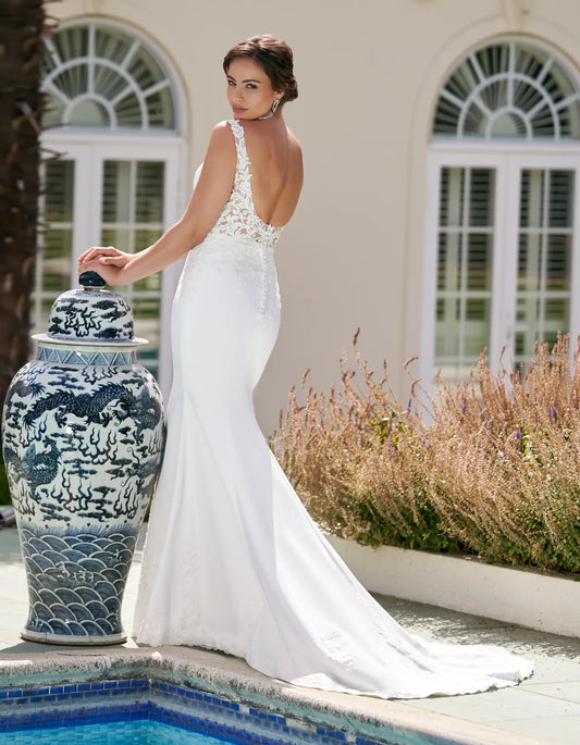 DingJiDress a sheath of lace and crepe with cut-out details