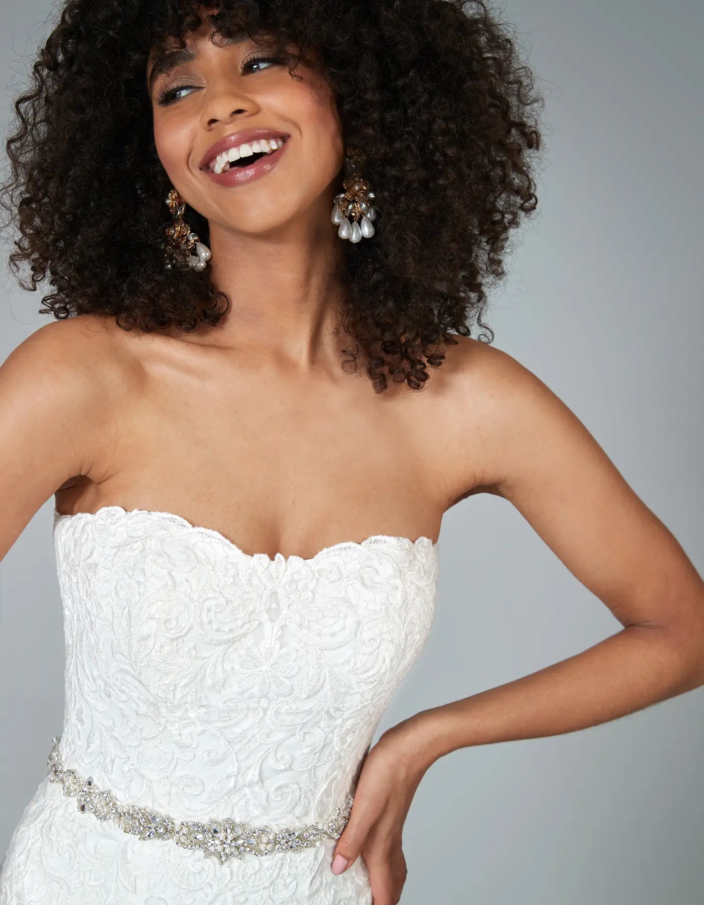 DingJiDress a traditional strapless gown with ornate lace Wedding Dresses