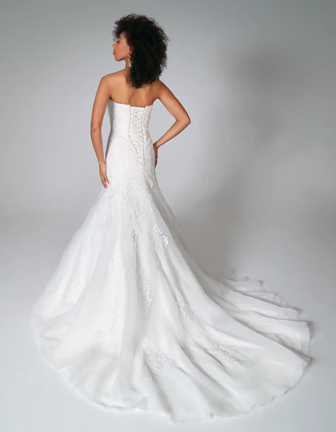 DingJiDress a traditional strapless gown with ornate lace Wedding Dresses