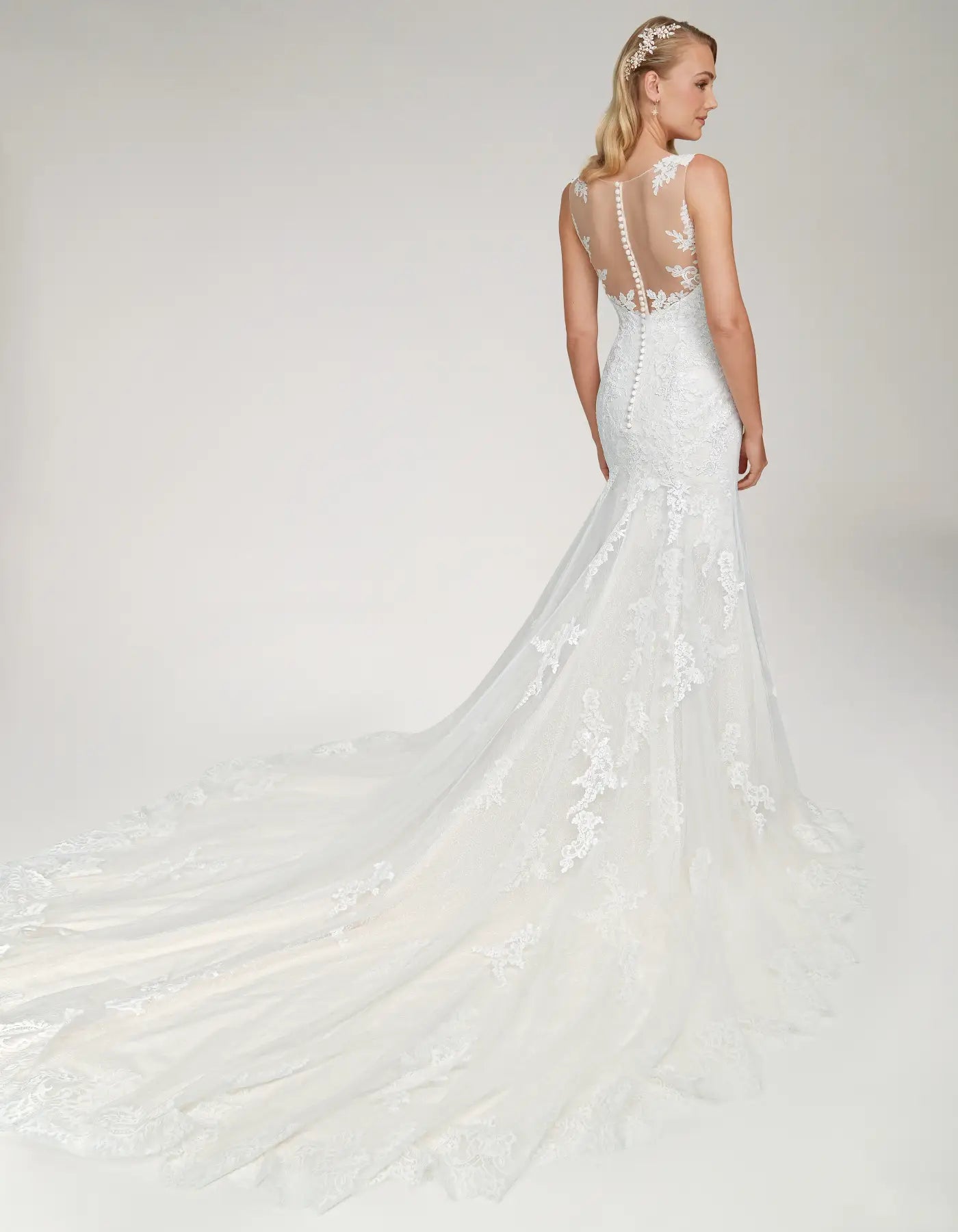 DingJiDress a mermaid gown with statement back and train