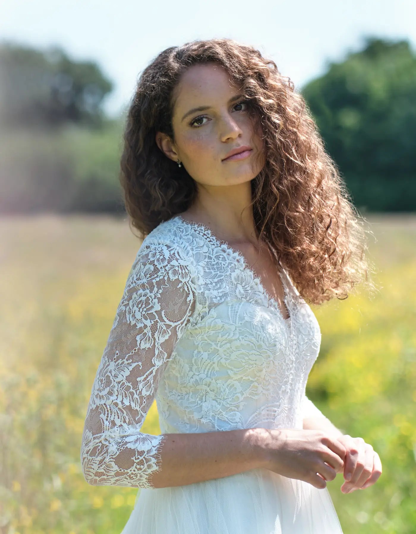 DingJiDress a chantilly lace gown with sleeves Wedding Dresses