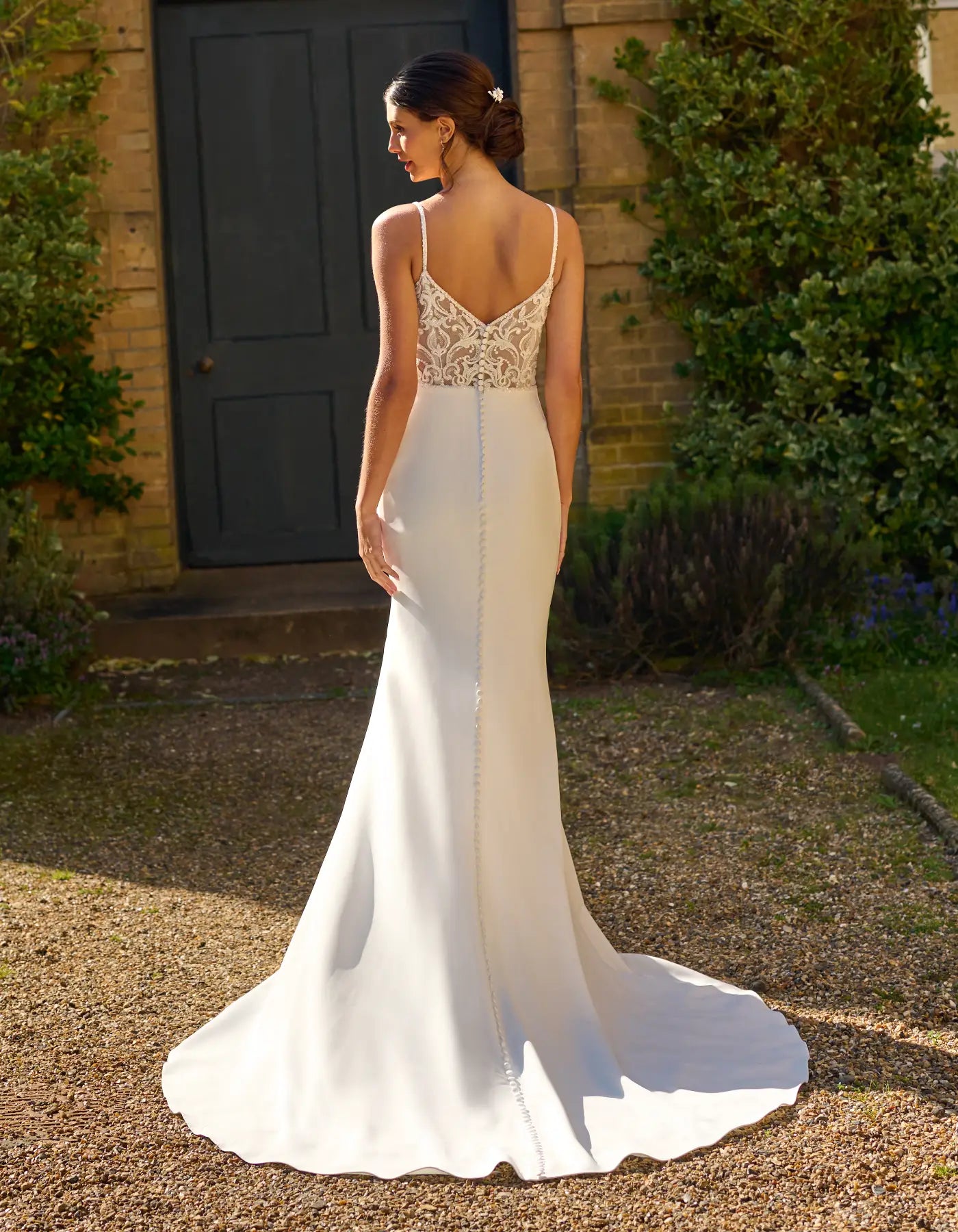 a crepe wedding dress with illusion back