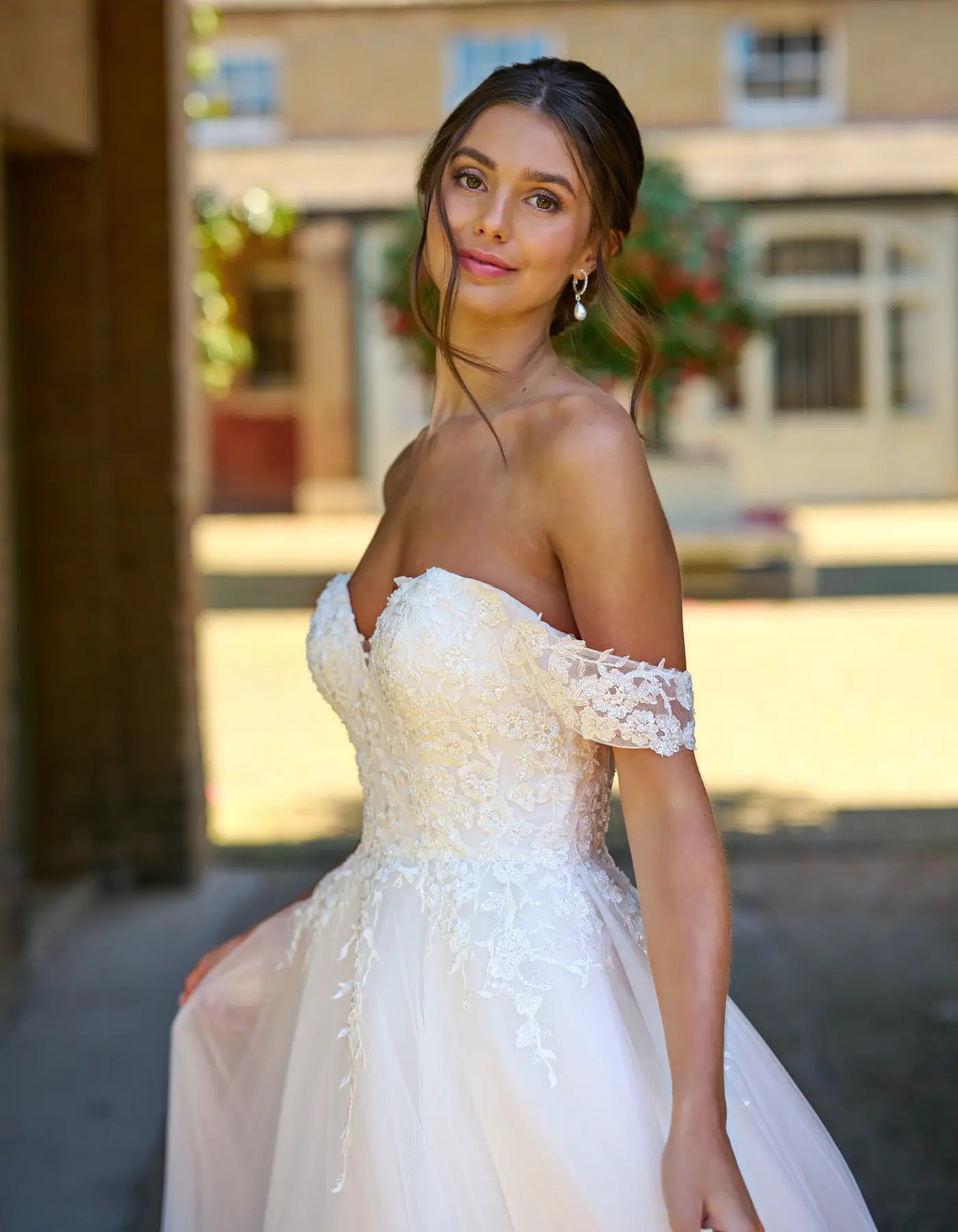 an off-the-shoulder tulle a-line