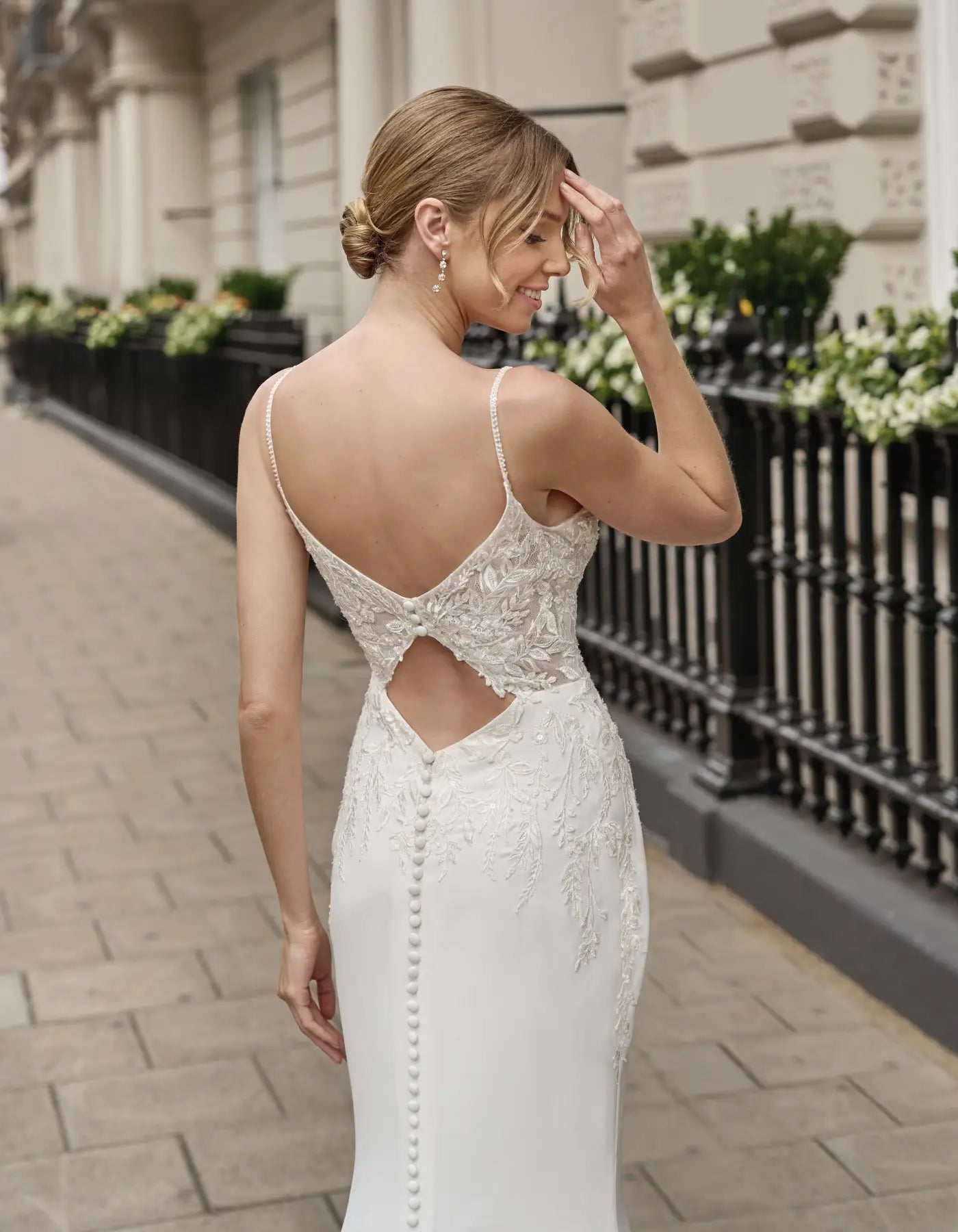 a lace and crepe gown with keyhole back