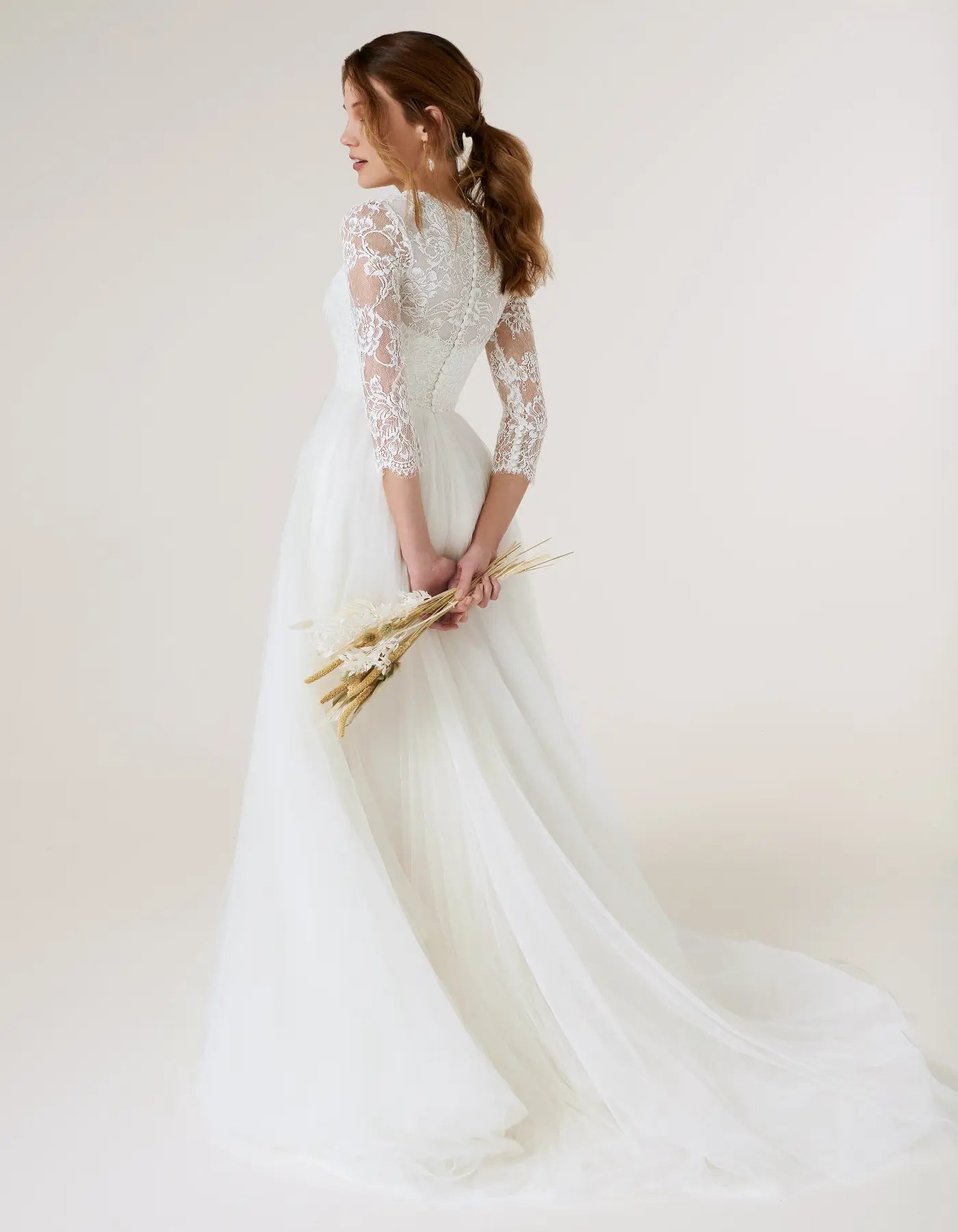 DingJiDress a chantilly lace gown with sleeves Wedding Dresses