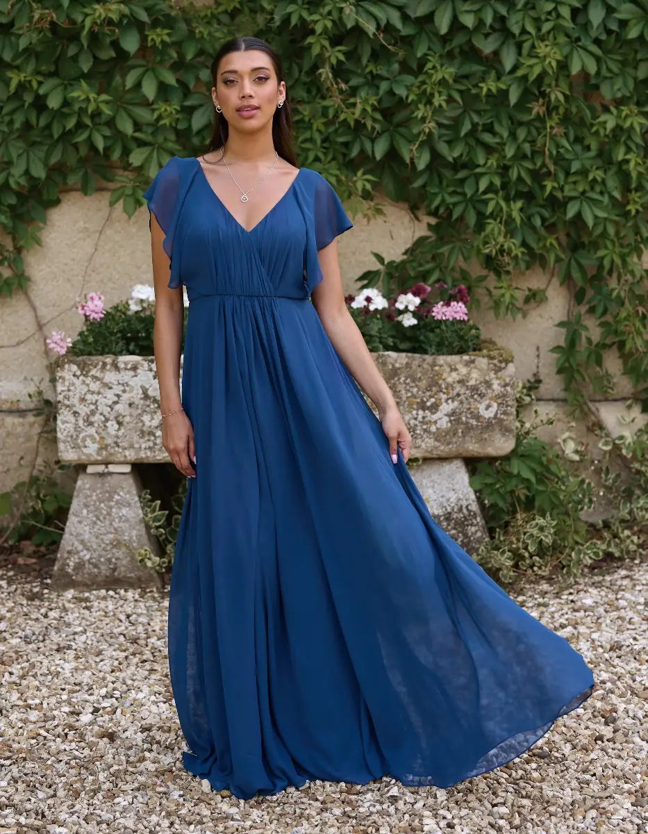 a modern draped bodice with lightweight angel sleeves