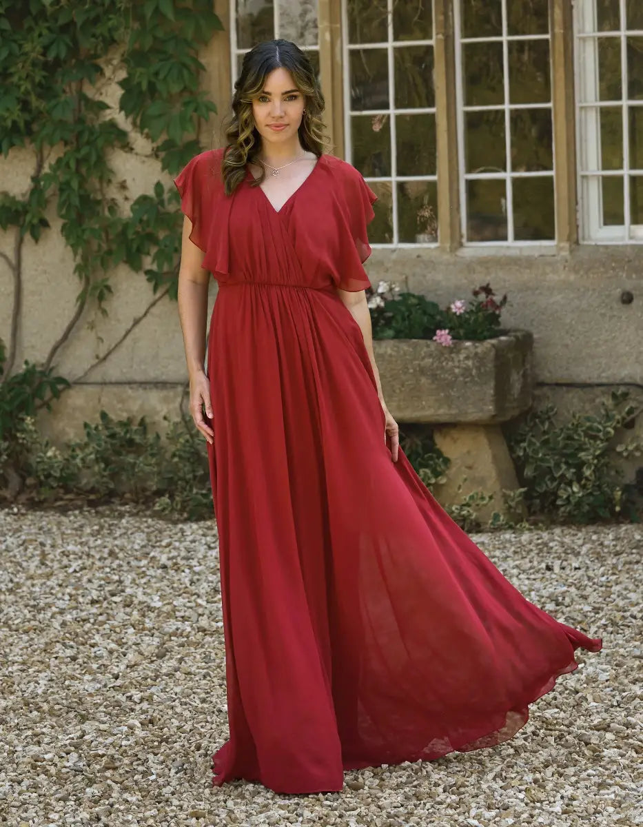a modern draped bodice with lightweight angel sleeves