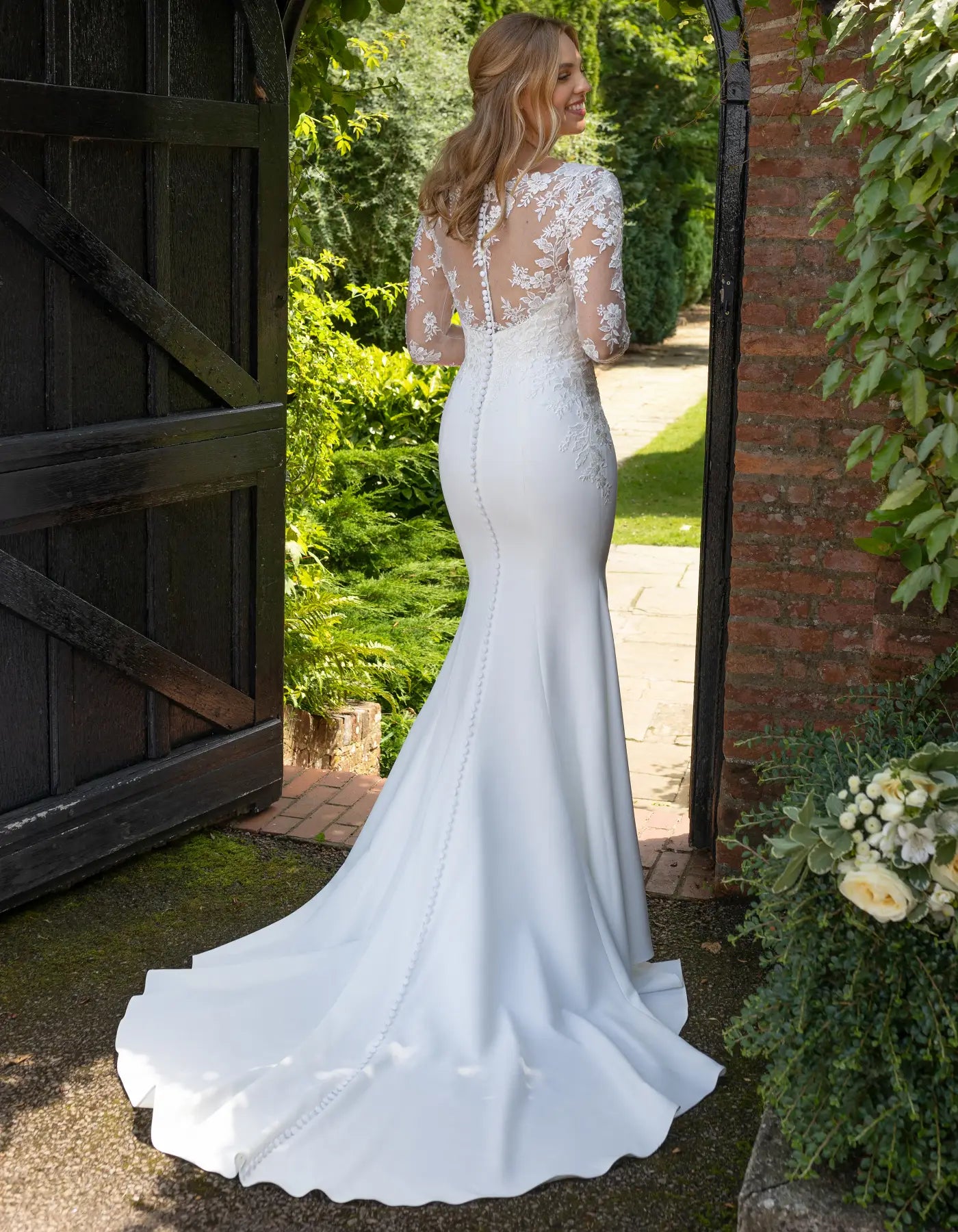 DingJiDress a crepe and lace sheath with full-length sleeves Wedding Dresses