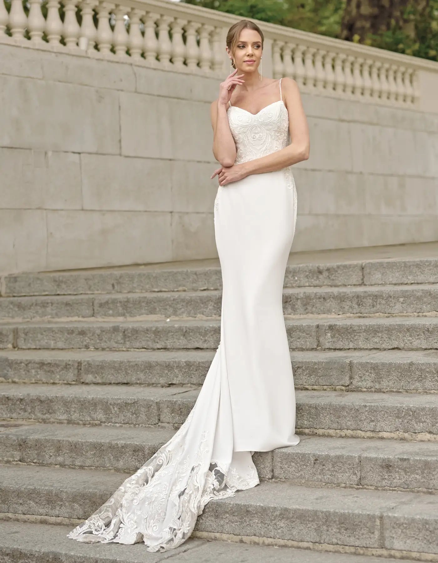 a sleek sheath gown with cut-out train